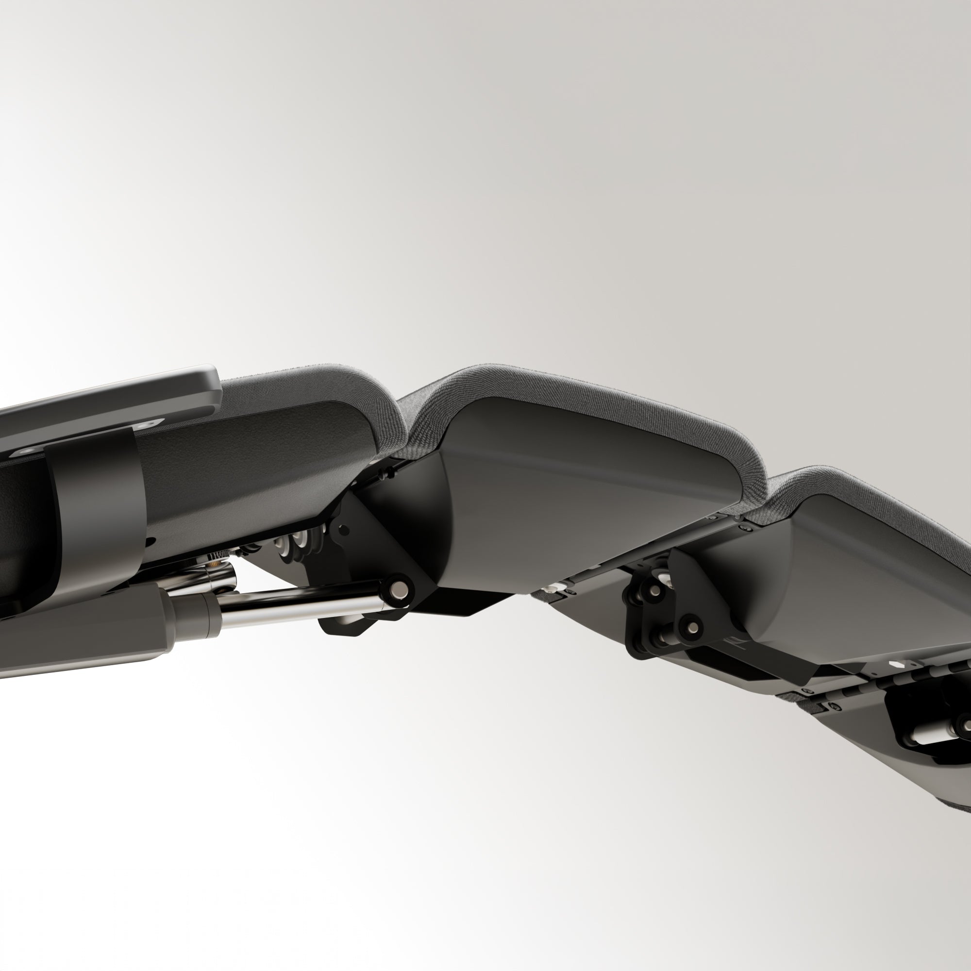 Close-up from below of the seat and leg rest of the Altwork Signature Station on a white background.